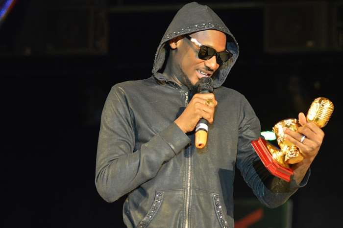 2Face from Nigeria admiring his Best RnB award trophy endorsed by Channel O at the 2014 AFRIMA award at the Grand Ballroom, Oriental Hotel, Victoria Island, Lagos recently