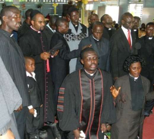 Reverend Albert Duodu (left)a and Reverend Gifty Boateng (right) receiving anointing from the Pastors