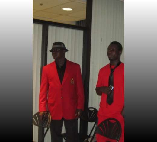 MOURNERS IN RED AND BLACK