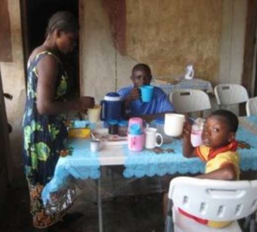 antie, shariff and junior having some tea for breakfast
