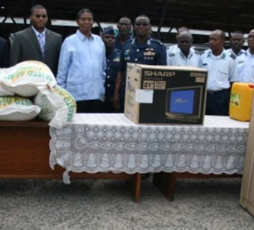 Dr Apostle Kwadwo Safo, founder of Kristo Asafo Church, presenting items to Air Force Marshall Micheal Samson Oje, Chief of Air Force Staff, looking on are other Air Force officers.  Credit GNA Photos
