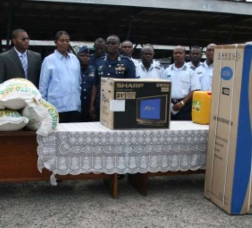 Dr Apostle Kwadwo Safo, founder of Kristo Asafo Church, presenting items to Air Force Marshall Micheal Samson Oje, Chief of Air Force Staff, looking on are other Air Force officers.  Credit GNA Photos