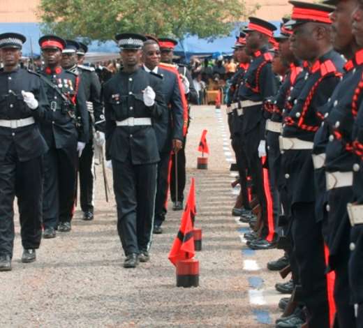 PRESIDENT MILLS REVIEWS THE GUARD OF HONOUR MOUNTED IN HIS HONOUR AT COURSE 42 GRADUATION