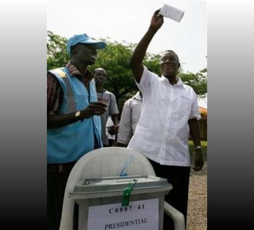 Opposition Presidential candidate John Atta Mills holds up his completed ballot prior to voting, at a polling station in Regimanuel Estate, in Accra, Ghana Sunday, Dec. 7, 2008. An estimated 12.4 million registered voters, roughly half the country s population of 23 million, will choose from one of eight candidates to succeed President John Kufuor, who is stepping down after two terms as required by law.(AP Photo/Rebecca Blackwell)