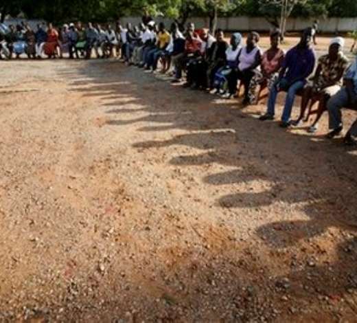 Voters wait patiently in line to cast their votes for president at the Accra Girls Secondary School in Accra, Ghana, Sunday, Dec. 7, 2008. An estimated 12.4 million registered voters, roughly half the country s population of 23 million, will choose from one of eight candidates to succeed President John Kufuor, who is stepping down after two terms as required by law. (AP Photo/Rebecca Blackwell)