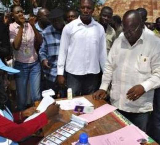 Ghana   s ruling New Patriotic Party   s presidential candidate Nana Akufo-Addo prepares to cast his ballot in Kibi
