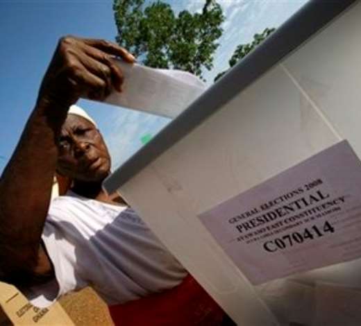 A Ghanaian woman casts her vote for president at the Accra Girls Secondary School in Accra, Ghana, Sunday, Dec. 7, 2008. An estimated 12.4 million registered voters, roughly half the country s population of 23 million, will choose from one of eight candidates to succeed President John Kufuor, who is stepping down after two terms as required by law. (AP Photo/Rebecca Blackwell)