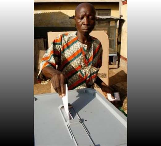 Freemia Adiui, wearing traditional Ghanaian clothes, casts his vote for president at the Victory International polling station in Kakuudi neighborhood, in Accra, Ghana Sunday, Dec. 7, 2008. An estimated 12.4 million registered voters, roughly half the country s population of 23 million, will choose from one of eight candidates to succeed President John Kufuor, who is stepping down after two terms as required by law. (AP Photo/Rebecca Blackwell)