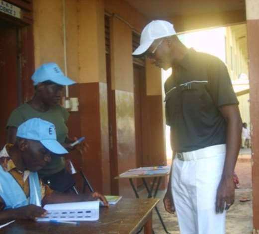 Mr Kwesi Amoafo-Yeboah Independent Presidential Candidate waiting for his named to be checked on the voters register