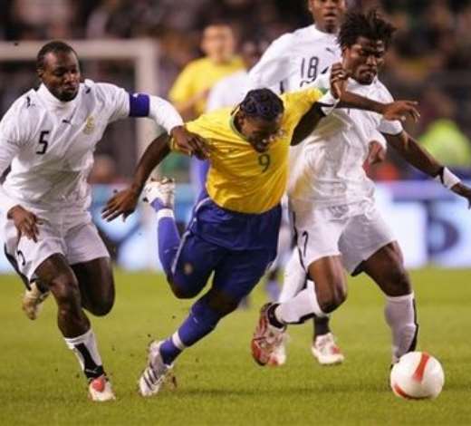Brazils Wagner Love, center, is fouled by Ghanas Lareya Kingston, right, and John Mensah, left, during the Brazil versus Ghana friendly soccer match, Rasundra stadium, Stockholm, Sweden, Tuesday March 27, 2007.