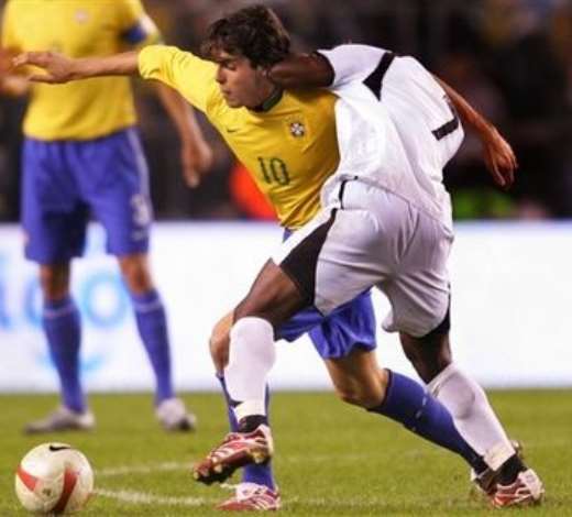 Brazils Kaka, left, is tackled by Ghanas Laryea Kingston, right, during the Brazil versus Ghana friendly soccer match, Rasundra stadium, Stockholm, Sweden, Tuesday March 27, 2007.