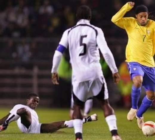 Brazils Ronaldinho, right, jumps to avoid a tackle by Ghanas Anthony Annan, left, during the Brazil versus Ghana friendly soccer match, Rasundra stadium, Stockholm, Sweden, Tuesday March 27, 2007.