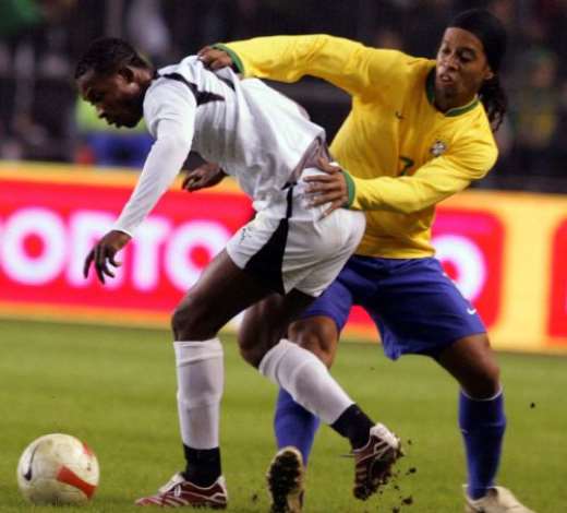 Brazils Ronaldinho (R) vies for the ball with Ghanas John Painstil (L) during their friendly international football match at Rasunda Stadium in Stockholm, 27 March 2007. FREDRIK PERSSON/AFP/Getty Images