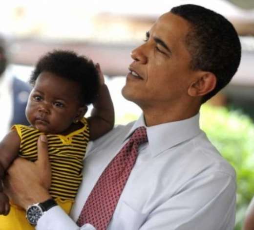 US President Barack Obama holds a child while participating in a maternal health program tour at LA General Hospital in Accra, Ghana 11 July 2009. EPA/SHAWN THEW