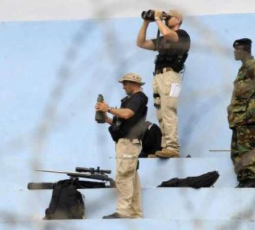 A US Secret Service Counter Sniper Team watches a helicopter landing zone in Cape Coast, Ghana 11 July 2009. President Obama is spending the day in Ghana addressing Parliament, visiting a maternal health program and touring Cape Coast Castle. EPA/SHAWN THEW