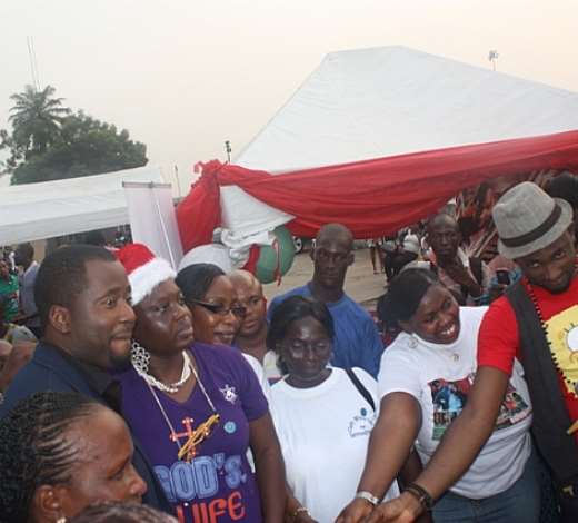 DESMOND ELLIOT MAKING HIS DONATION TO THE WIDOWS