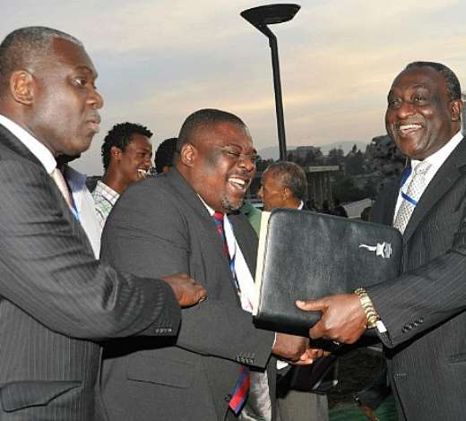 Mr Alan Kyeremanten (R)Former Trade Minister exchanges pleasantries with Mr Koku Anyidoho, the Director of Communications at the presidency of Ghana at the unveiling ceremony of Nkrumahs Statue. With them is Mr Eugene Owusu, UNDP Representative in Ethiopia
