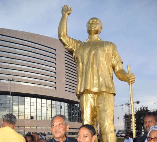 Proud children of Ghanas first President, Dr. Kwame Nkrumah, standing by their fathers statue in front of the new AU building