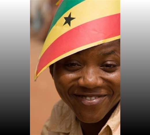 A woman looks on as she wears a make-shift Ghanaian flag-hat on her head at Accra, Ghana, Monday, March 5, 2007. Fifty years on, battered by political repression, military dictatorship and economic collapse that has bedeviled the entire continent, Ghanas hopes are diminished, even after seeing its first peaceful and democratic changeover of government in 2000. The West African nations Golden Jubilee on Tuesday is prompting some sober reflection on why Africa has failed to translate its dreams, and its bounty of mineral and agricultural resources, into wealth. (AP Photo/Olivier Asselin)