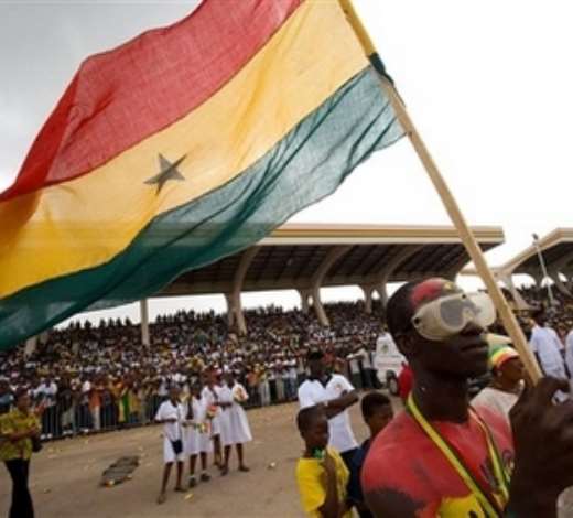A man holds the Ghana flag, during celebrations to commemorate Ghanas 50 years of independence at the Independence Square in Accra, Ghana, Tuesday, March 6, 2007. Lasers lit the sky and an actor relived the emotional moment 50-years ago when independence leader Kwame Nkrumah declared Ghana free forever to kick off celebrations Tuesday in the first sub-Saharan African nation to break from Europe. (AP Photo/Olivier Asselin)