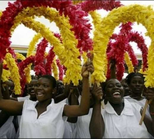 Ghanian girls attend celebrations of the 50th anniversary of Ghanas independence in Accra. Ghanaians turned out in their thousands Tuesday for colourful ceremonies marking independence from Britain 50 years ago when the country became the first black African state to break the bonds of colonial rule.(AFP/Kambou Sia)