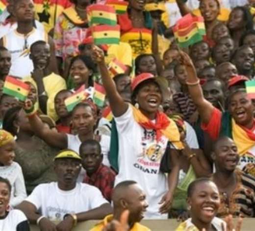 People wave flags during a celebration to mark Ghanas 50 years of Independence at the Independence Square in Accra, Ghana, Tuesday, March 6, 2007. Lasers lit the sky and an actor relived the emotional moment 50 years ago when independence leader Kwame Nkrumah declared Ghana free forever to kick off celebrations Tuesday in the first sub-Saharan African nation to break from Europe.(AP Photo/Olivier Asselin