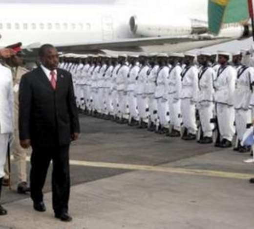 Democratic Republic of Congo President Joseph Kbila (3rd L) inspects a guard of honour upon arrival in Ghanas capital, Accra, March 6, 2007. Thousands of Ghanaians danced in the streets into the early hours of Tuesday in celebrations marking the 50th birthday of the first nation in sub-Saharan Africa to win independence. REUTERS/Yaw Bibini (GHANA)