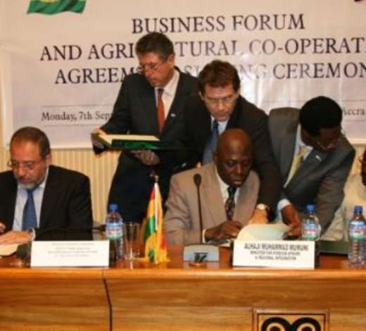 Alhaji Muhammad Mumuni, Ghana s Foreign Minister (right), signing the Agreement and Joint Declaration with Mr Avigdor Liberman, Deputy Prime Minister /Foreign Minister of Israel (left).