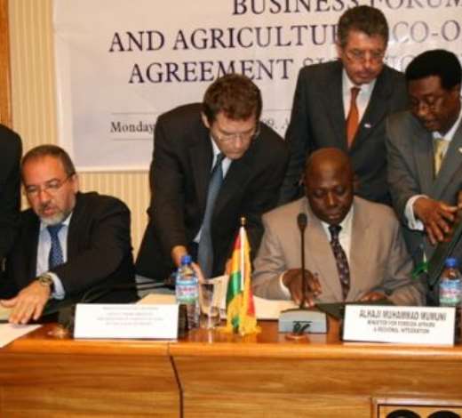 Alhaji Muhammad Mumuni, Ghana s Foreign Minister (right), signing the Agreement and Joint Declaration with Mr Avigdor Liberman, Deputy Prime Minister /Foreign Minister of Israel (left).