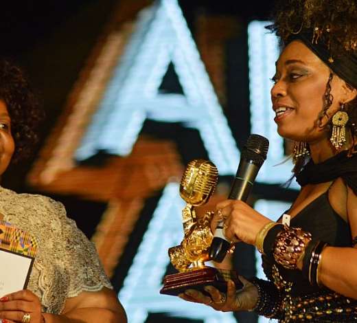 L-R: Head of culture and social affairs, African Union Commission, Mrs. Angela Martins presenting the AFRIMA Legend Award won by Fela Anikulapo Kuti to his daughter, Yeni Kuti, at the 2014 AFRIMA awards ceremony held at Grand Ballroom, Oriental Hotel, Lagos recently.
