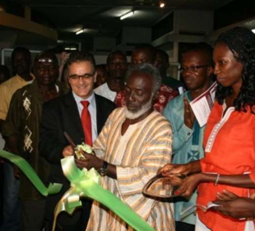 Mr Nana Yaw Poku Dankwa, Director of Ministry of Chieftaincy and Culture, cutting the tape to exhibit paintings, textiles and sculptures with some of the executives of (GAVA).
