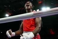 Boxer Ngamba wins Refugee Olympic Team's first medal ever