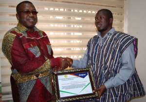 Mr Abdallah Musah (right) of the Humanity Magazine International presenting the award to Dr. Ben. KD Asante (left)