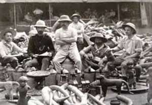 Members of the nefarious British Punitive Expedition of 1897 posing proudly with looted Benin artefacts.
