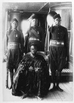 Oba Ovonramwen during whose reign the British invaded Benin and looted the Benin bronzes, on his way to exile in 1897Calabar. The king is in shackles that are covered by the long gown Photo by the Ibani Ijo photographer J.A.Green.