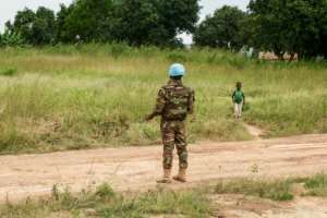 A Bangladeshi peacekeeper stands on the road to Koui, 3Rs stronghold.  By Camille Laffont (AFP)