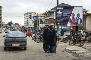 A billboard in the capital Conakry urges a yes vote for the draft constitution.  By PATRICK MEINHARDT (AFP)