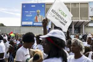 A billboard of Guinea President Mamady Doumbouya is seen during a yes vote rally at the Peoples Palace in Conakry on September 18, 2025.  By PATRICK MEINHARDT (AFP)