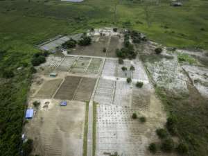 A birds-eye view shows white, infertile soil and black, fertilised soil on a farm supported by the World Food Programme in the village of Inye, on the outskirts of Kinshasa.  By Glody MURHABAZI (AFP)