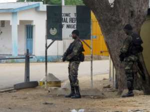 A Cameroonian soldier on guard in Amchide in 2014. Although some inhabitants have returned after a call by the authorities to come home, Amchide is a shadow of its former self.  By Reinnier KAZE (AFP)
