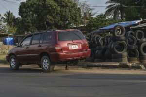 A car is serviced next to Mory Soumaoros workshop in Liberia.  By MATTHEW JACOBS (AFP)