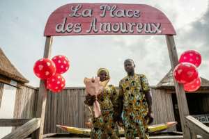 A couple poses at the Place des Amoureux during a date ahead of Valentines Day.  By Yanick Folly (AFP)