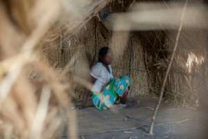 A displaced woman at a camp for displaced people on the outskirts of Pemba, the capital of the northern Cabo Delgado province.  By Alfredo Zuniga (AFP)