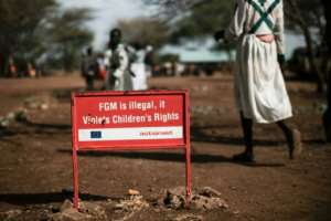 A growing international campaign seeks to stamp out female genital mutilation (FGM) -- this sign is in Katabok village, northeastern Uganda.  By Yasuyoshi CHIBA (AFP)