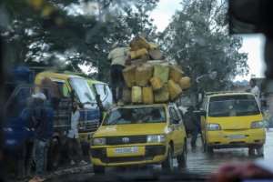 A man stacks jerrycans on top of a vehicle in Bukavu amid fears the conflict could descend into a regional war.  By Amani Alimasi (AFP)