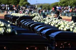 A relative mourns the 45 victims of a bus accident in Botswana in May.  By Monirul Bhuiyan (AFP)