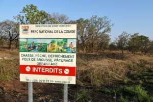 A sign warns it is forbidden to hunt, fish, clear land or graze livestock in the Comoe National Park, a world heritage site.  By Sia KAMBOU (AFP)