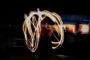 A ski instructor at Afriski in Lesotho swirls fire ahead of a torchlight procession from the top of the main slope.  By MARCO LONGARI (AFP)