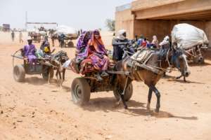 A steady stream of horse-carts arrived at the Adre border post under the regions scorching desert sun.  By Joris Bolomey (AFP)