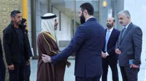 A Syrian Arab News Agency picture shows Ahmed al-Sharaa (R) welcoming Bahrains Sheikh Ahmed bin Abdulaziz al-Khalifa.  By - (SANA/AFP)